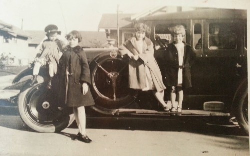 my moms sisters and my nana lookin out the window of a westcott car....before grandad lost it all in the crash of '29